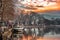 Sunset on lake Pamvotis. Docked boat ready to transfer people to the small island. Greece.