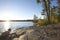 Sunset on lake with rocky shore in northern Minnesota