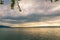 Sunset on lake with wooden pier on overcast day. Zug, Switzerland