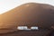 Sunset Lanzarote landscape with mountains and traditiona white h