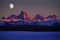 Sunset Light Alpen Glow on Tetons Teton Mountains wtih Moon Rising