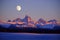 Sunset Light Alpen Glow on Tetons Teton Mountains wtih Moon Rising