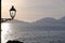 Sunset light on the sea of the Gulf of La Spezia. Street lamp in the marine village of Tellaro, near the CinqueTerre