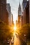 Sunset light shining on the buildings and cars on 42nd Street in Midtown New York City around the time of the Manhattanhenge