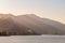 Sunset light streams through the hollows of the hills along the Columbia River near Mosier, Oregon