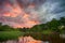 Sunset long the banks of the Amazon river. The tributaries of the Amazon traverse the countries of Guyana, Ecuador, Peru, Brazil,