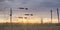 Sunset Looking Through Wire Livestock Fence with Tensioners