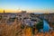 Sunset at lookout of Toledo, Spain. Tajo river around the city and Alcazar and Cathedral at background.