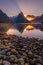 Sunset magic reflections in Milford Sound, New Zealand during winter