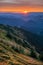 Sunset from Mala Chochula mountain during autumn with orange coloured sky after sunset