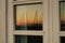 Sunset in marina, reflected in window