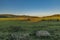 Sunset meadows with stones near Zbytiny village