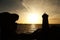 Sunset at Men ruz lighthouse at Pink Granite coast in Brittany