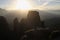 Sunset in Meteora, Greece. With the silhouette of a woman