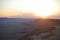 Sunset at Mitzpe Ramon crater, camel rock at Makhtesh Ramon, Negev desert, South Israel