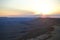 Sunset at Mitzpe Ramon crater, camel rock at Makhtesh Ramon, Negev desert, South Israel