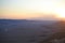 Sunset at Mitzpe Ramon crater, camel rock at Makhtesh Ramon, Negev desert, South Israel