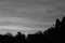 Sunset moody black and white soft flowing clouds horizontal with footer text area