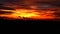 Sunset on the mountain and dark red yellow orange flame cloud on sky