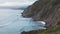 Sunset in the mountain natural landscape. Green valley on background dramatic sky, clouds, sea ocean. Panorama horizon perspective