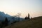 Sunset in mountain with two ethnic sisters playing on hills