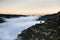 Sunset in a mountain valley. Dramatic moving cloud. Travel destination.