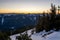 Sunset in the mountains. Mountainous relief with snow. Peaks of the mountains