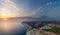 Sunset near cape Aspro cliffs aerial panorama from drone, Limassol