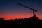 The sunset in the neighbourhood with the crane silhouette