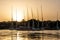 Sunset Nile Aswan the West Bank with small village houses with fishing sailing boats felucca