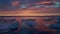 Sunset north antarctic icebergs frost pieces in water by red orange sunset clouds video of arctic nature ice landscape