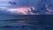 Sunset at ocean bay waves aerial view nature seascape Sunset light Dramatic dark clouds in sunset sky drone shot high angle view