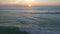 Sunset at ocean bay waves aerial view nature seascape Sunset light Dramatic dark clouds in sunset sky drone shot high angle view