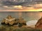 Sunset on the ocean, coast of Portugal, famous cliffs and caves, beach, ship, waves, beautiful clouds