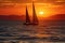 Sunset on the ocean with sailing yachts on the horizon