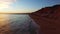 Sunset at oceanside cliffs beach aerial Portugal Algarve aerial view