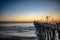Sunset by Oceanside Pier, Palms and the Pacific Oceanin the famous surf city in California USA