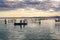 Sunset on one day cloudy in the famous lake of the albufera of Valencia, spain with a boat in the front