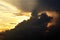 Sunset in the open ocean. Colorful views of the surface of the water and the sky with clouds over ocean.