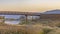 Sunset at Oquirrh Lake with bridge and mountain