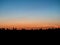 Sunset orange and blue skyline silhouetted horizon