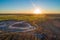 Sunset over agricultural land and desert in Australia.