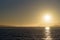 Sunset over Alcatraz island in San Francisco bay area, with Golden Gate bridge in background