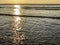 Sunset over the Atlantic Ocean from sand beach in Agadir, Morocco, Africa