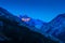 Sunset over blue Caucasian mountain peaks