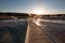 Sunset over boardwalk at the Old Faithful geyser basin in Yellowstone National Park in Wyoming USA