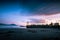 Sunset over boats moored in harbor in Port Orford.