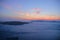 Sunset over the caldera seen from Fira, Santorini, Greece with cruise ship