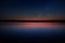 Sunset over Calm Lake with Real Stars in Dark Sky