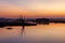 Sunset over calm Taungthaman lake in Myanmar near.